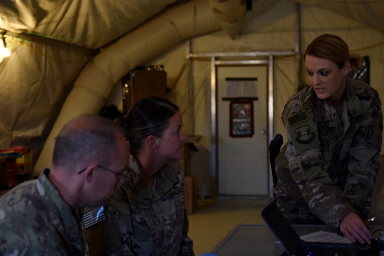 Master Sgt. Nikki Walberg, 386th Air Expeditionary Wing paralegal, trains 442nd Air Expeditionary Squadron senior enlisted leaders on notarizations at an undisclosed location, May 17, 2018. Walberg travels across the U.S. Central Command area of responsibility to assist with legal needs. (U.S. Air Force photo by Tech. Sgt. Caleb Pierce)