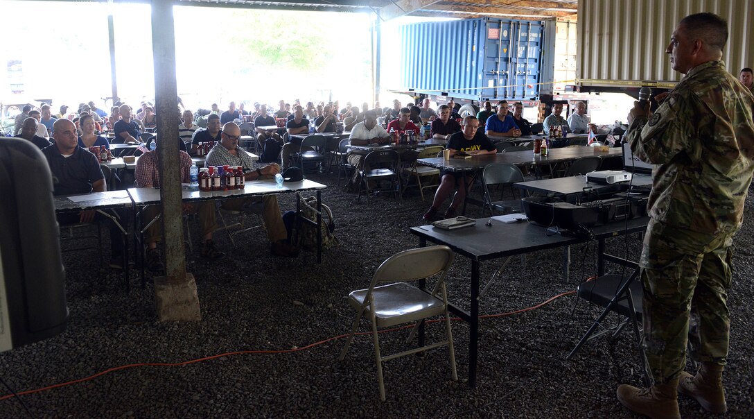 Maj. Al Cavazos (right), Combined Joint Task Force Hope Information Operations Cell officer-in-charge, briefs 300 new U.S. military personnel arriving in El Salvador on what to expect and how to conduct themselves during an in-brief, June 23, 2018, at Forward Operating Base Miraflores in La Paz Department in southeastern El Salvador.