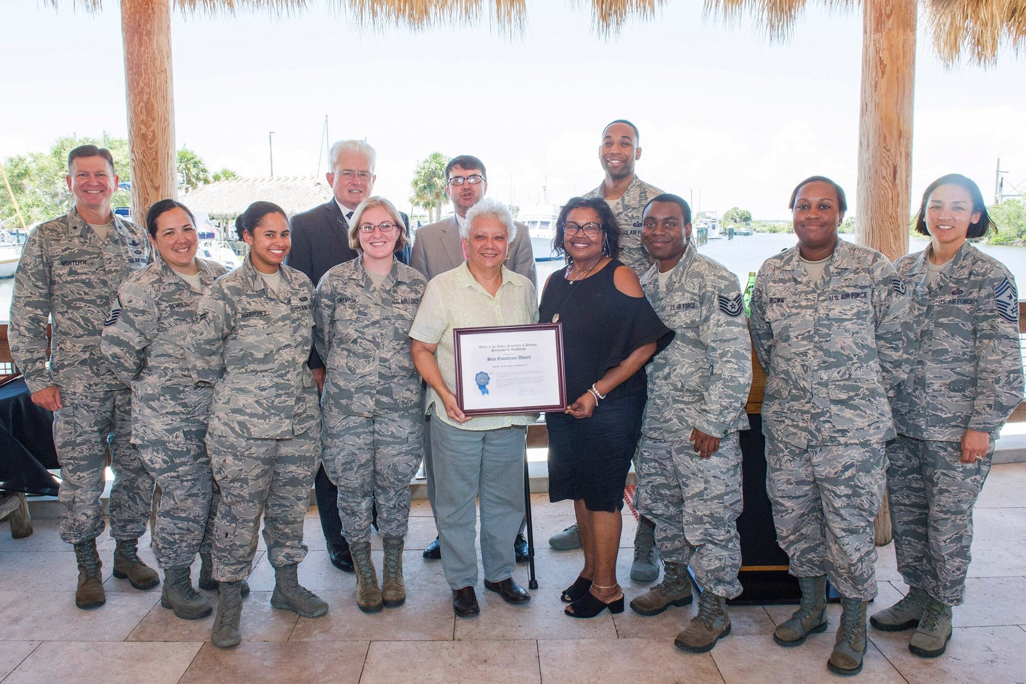 Members from the 45th Force Support Squadron pose for a photo May 17, 2018, with the Site Excellance Award at Patrick Air Force Base, Fla. The award was presented to FSS by Brig. Gen. Wayne Monteith, commander of the 45th Space Wing, for exceptional service and support of DEERS and RAPIDS. (U.S. Air Force photo by Phil Sunkel)