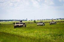 Airmen from the 23d Civil Engineer Squadron (CES), ride in Humvees during tactical convoy operations training, June 21, 2018, at Moody Air Force Base, Ga. For the first time at Moody, 820th Base Defense Group personnel equipped 23d CES Airmen with convoy operations skills to efficiently perform mine-resistant, ambush-protected vehicle roll-over simulator evacuations. (U.S. Air Force photo by Airman 1st Class Eugene Oliver)