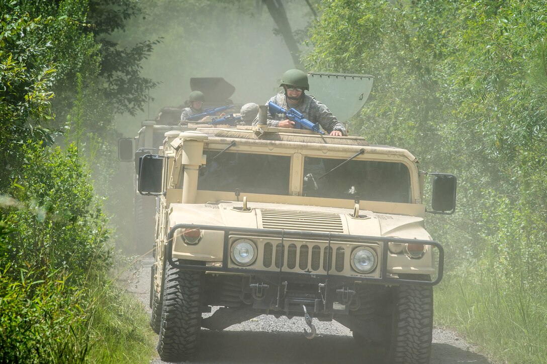 Airmen from the 23d Civil Engineer Squadron (CES) ride in Humvees during tactical convoy operations training, June 21, 2018, at Moody Air Force Base, Ga. For the first time at Moody, 820th Base Defense Group personnel equipped 23d CES Airmen with convoy operations skills to efficiently perform mine-resistant, ambush-protected vehicle roll-over simulator evacuations. (U.S. Air Force photo by Airman 1st Class Eugene Oliver)