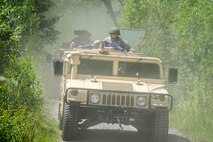 Airmen from the 23d Civil Engineer Squadron (CES) ride in Humvees during tactical convoy operations training, June 21, 2018, at Moody Air Force Base, Ga. For the first time at Moody, 820th Base Defense Group personnel equipped 23d CES Airmen with convoy operations skills to efficiently perform mine-resistant, ambush-protected vehicle roll-over simulator evacuations. (U.S. Air Force photo by Airman 1st Class Eugene Oliver)
