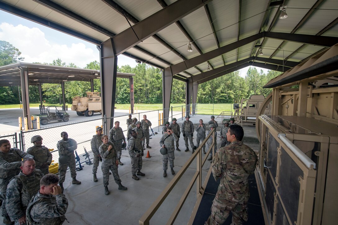Staff Sgt. Ulysses Ortiz, right, 820th Combat Operations Squadron unit trainer, instructs procedures to Airmen from the 23d Civil Engineer Squadron (CES) during tactical convoy operations training, June 21, 2018, at Moody Air Force Base, Ga. For the first time at Moody, 820th Base Defense Group personnel equipped 23d CES Airmen with convoy operations skills to efficiently perform mine-resistant, ambush-protected vehicle roll-over simulator evacuations. (U.S. Air Force photo by Airman 1st Class Eugene Oliver)