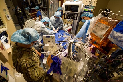 Members of the Acute Lung Resuce Team from the 59th Medical Wing, Joint Base San Antonio-Lackland, Texas, perform an Extra Corporeal Membrane Oxygenation procedure on a patient in El Paso, Texas, June, 10, 2018. The team is the Department of Defense's only medical evacuation team with ECMO capabilities. ECMO enables the team to safely transfer critically ill patients with severe heart and lung issues across long distances for further treatment.
