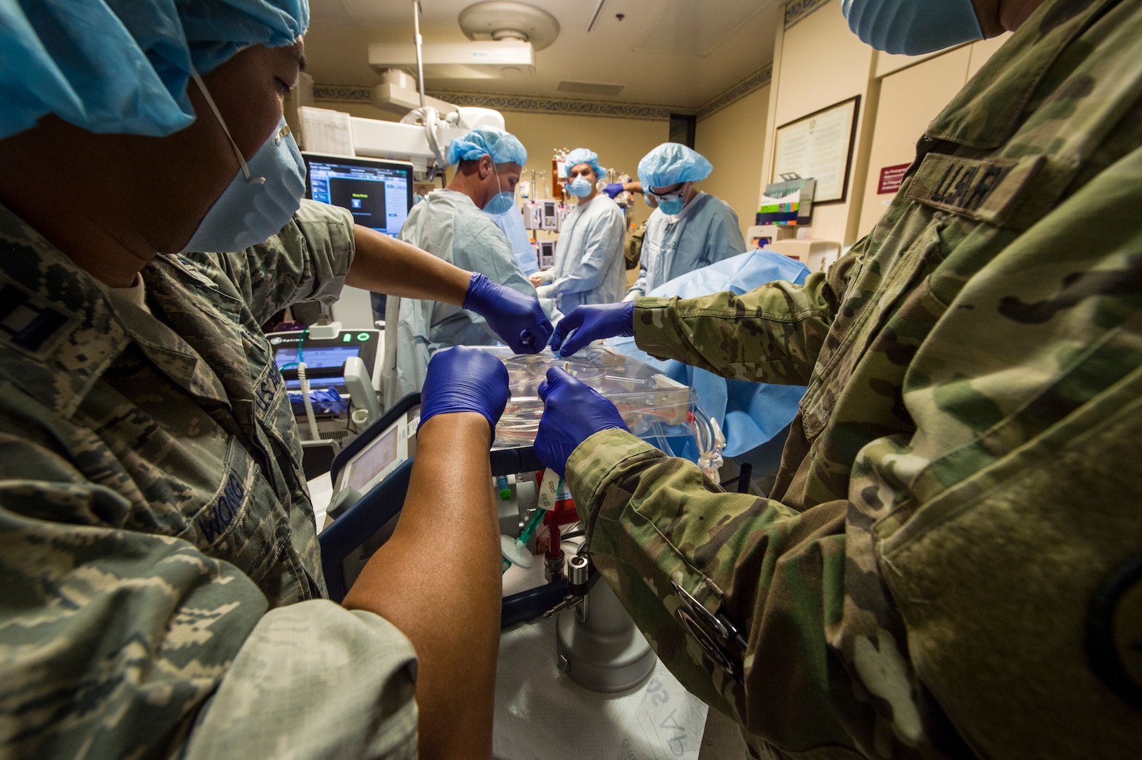 Members of the Acute Lung Resuce Team from the 59th Medical Wing, Joint Base San Antonio-Lackland, Texas, perform an Extra Corporeal Membrane Oxygenation procedure on a patient in El Paso, Texas, June, 10, 2018. The team is the Department of Defense's only medical evacuation team with ECMO capabilities. ECMO enables the team to safely transfer critically ill patients with severe heart and lung issues across long distances for further treatment.