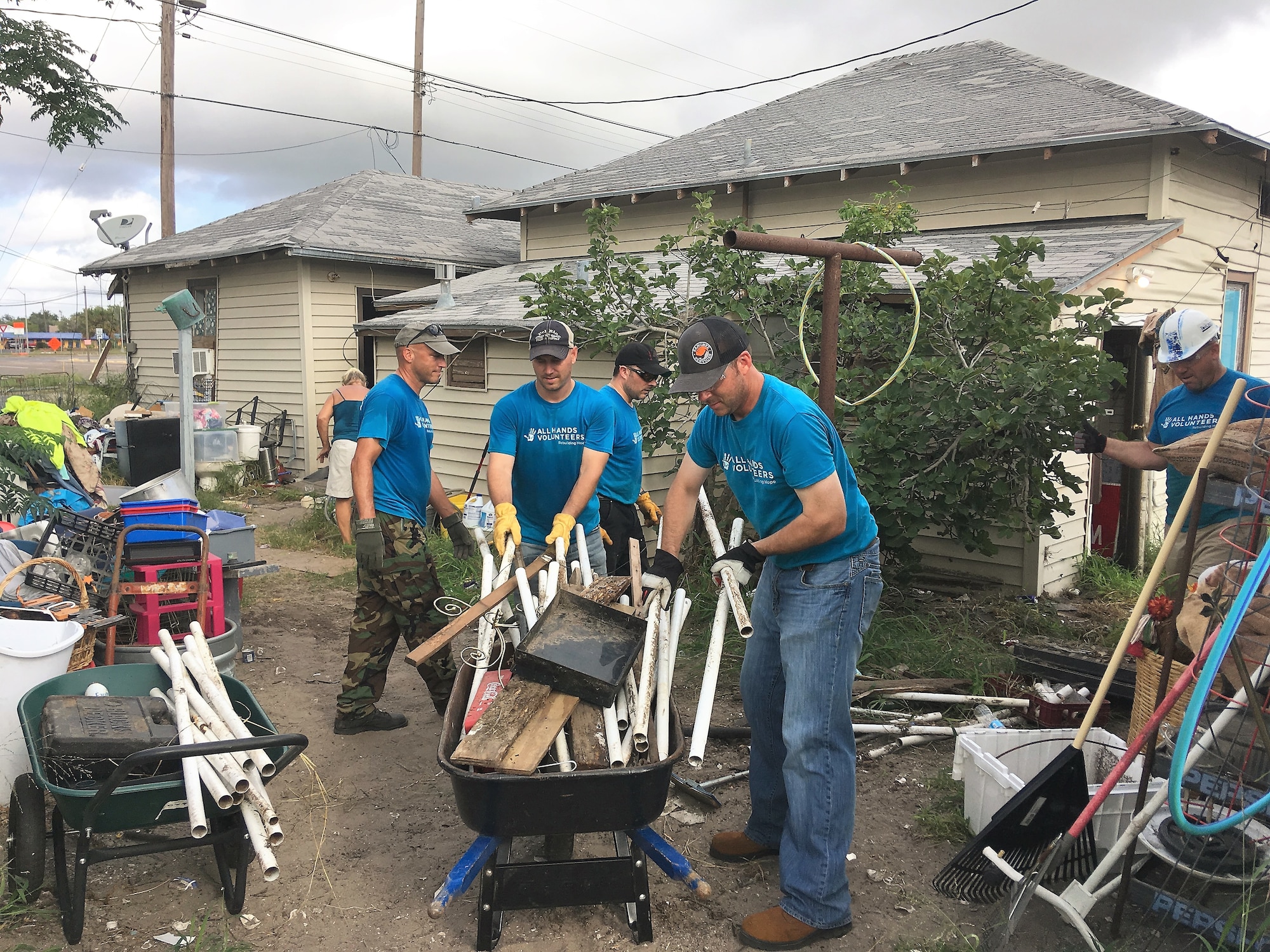 A handful of Airmen from the 96th Flying Training Squadron, Laughlin Air Force Base, Texas, help clean up damage to a home caused by Hurrican Harvey in August 2017. “Boxing Bunny” volunteers  pictured here with the homeowner (back to the camera, far right) include - left to right - Lt. Col. Doug Hayes, Maj. Brian Boettger, Lt. Col. Vinny Danna, 96th FTS Commander Lt. Col. Keith Shearin and Lt. Col. Wolfgang Von Aspe. (U.S. Air Force photo Maj. Jacob Hostetler, jan96th FTS)