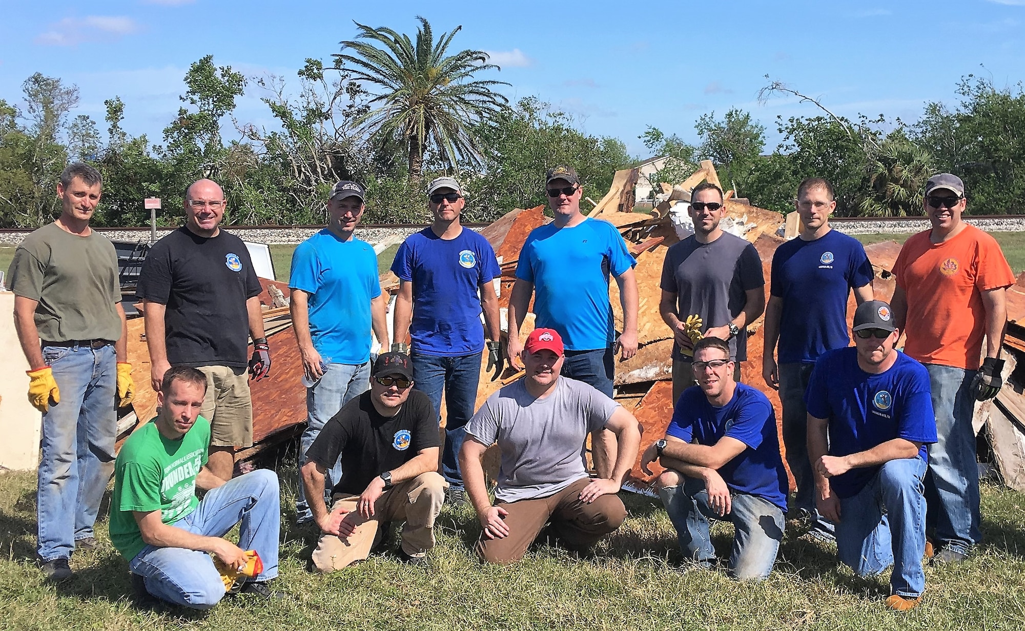 More than a dozen members of the 96th Flying Training Squadron, Laughlin Air Force Base, Texas, used their vacation time to help victims recover from the catastrophic damage incurred during Hurricane Harvey in August 2017. Back row, left to right: Lt. Col. Kervin Waterman, Lt. Col. Wolfgang Von Aspe, Maj. Brian Boettger, Lt. Col. Doug Hayes, Maj. Sam Moore, Maj. William Pope, Lt. Col. Matt Behnken and Lt. Col. Chris Perkins. Front row, left to right: Maj. Aric Wagner, Lt. Col. Vinny Danna, Lt. Col. Kent Bolster, Maj. Jake Hostetler and 96th FTS Commander Lt. Col. Keith Shearin. (U.S. Air Force photo by Maj. David Mitchell, 96th FTS)