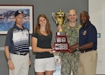 DLA Senior Enlisted Leader and DLA Director present sports and fitness cup.