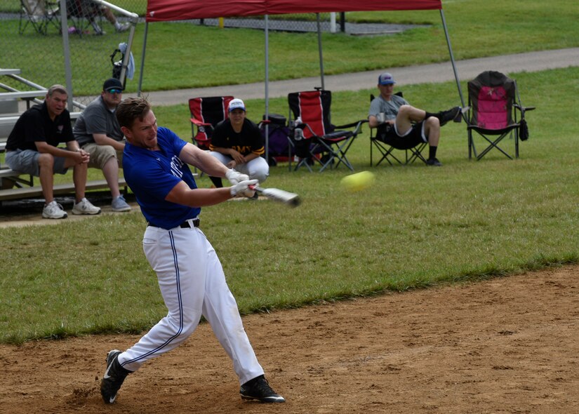 Staff Sgt. Matthew Riggins, National Capital Region Air Force softball team outfielder, connects with the ball during the preliminary round of the Armed Services Classic softball tournament at Jericho Park in Bowie, Md., June 23, 2018. Teams from all five military branches competed for a chance to play in the championship game at Nationals Park in Washington, D.C. (U.S. Air Force photo by Senior Airman Abby L. Richardson)