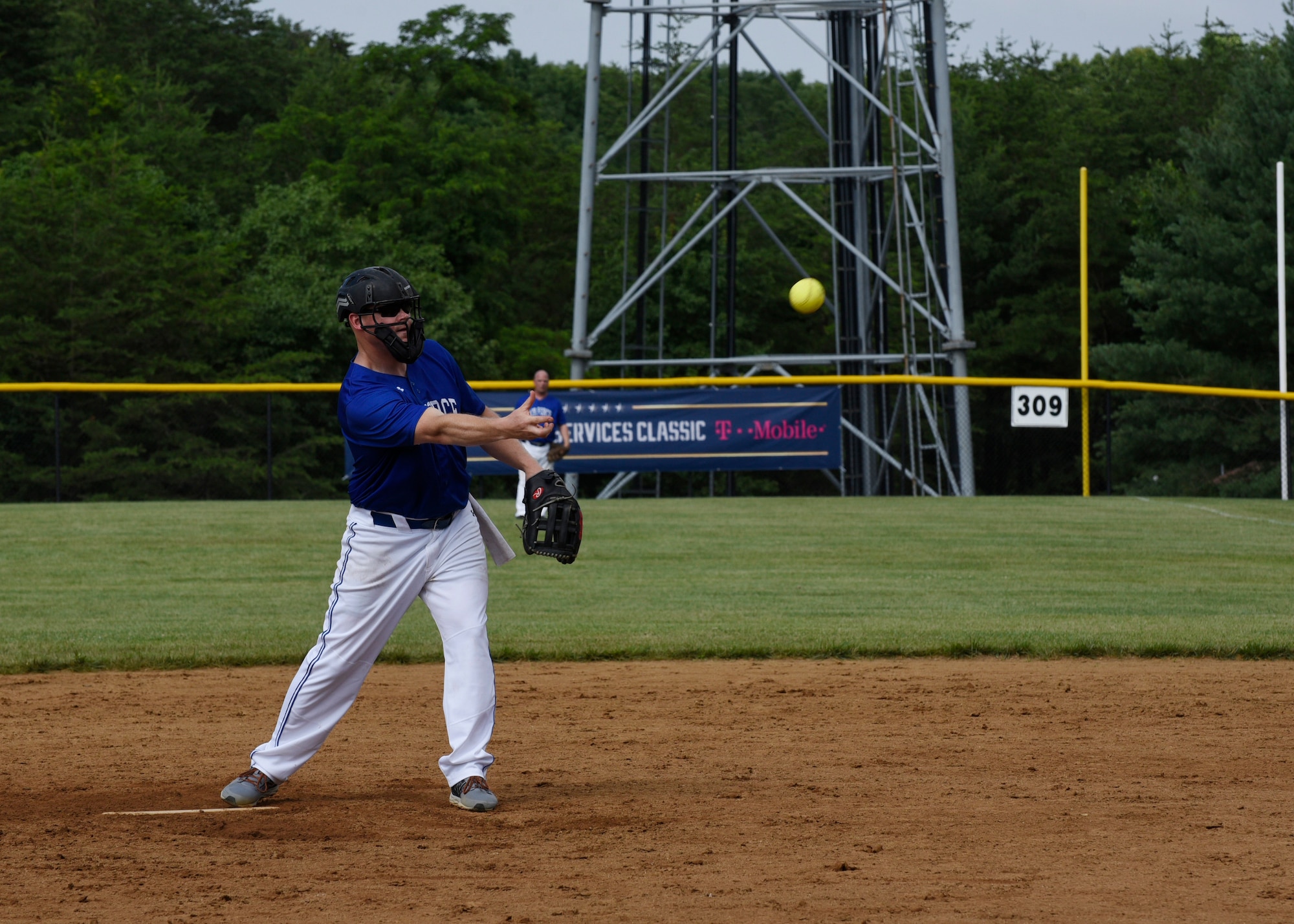 Master Sgt. Matt Campbell, National Capital Region Air Force softball team pitcher, pitches during the preliminary round of the Armed Services Classic softball tournament at Jericho Park in Bowie, Md., June 23, 2018. The Air Force team will compete in the championship game scheduled for July 13 at Nationals Park in Washington, D.C. (U.S. Air Force photo by Senior Airman Abby L. Richardson)