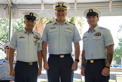 Senior Chief Petty Officer Brian Martin assumes command of Coast Guard Station Charleston from Senior Chief Petty Officer Justin Longval during a change of command ceremony, June 22, 2018, in Charleston, S.C. Capt. John Reed, the commanding officer of Coast Guard Sector Charleston, presided over the ceremony.