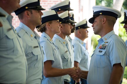 Senior Chief Petty Officer Justin Longval and Senior Chief Petty Officer Brian Martin conduct a personnel inspection during a change of command ceremony, June 22, 2018, in Charleston, S.C.. During the ceremony, Longval transferred command of Station Charleston to Martin.