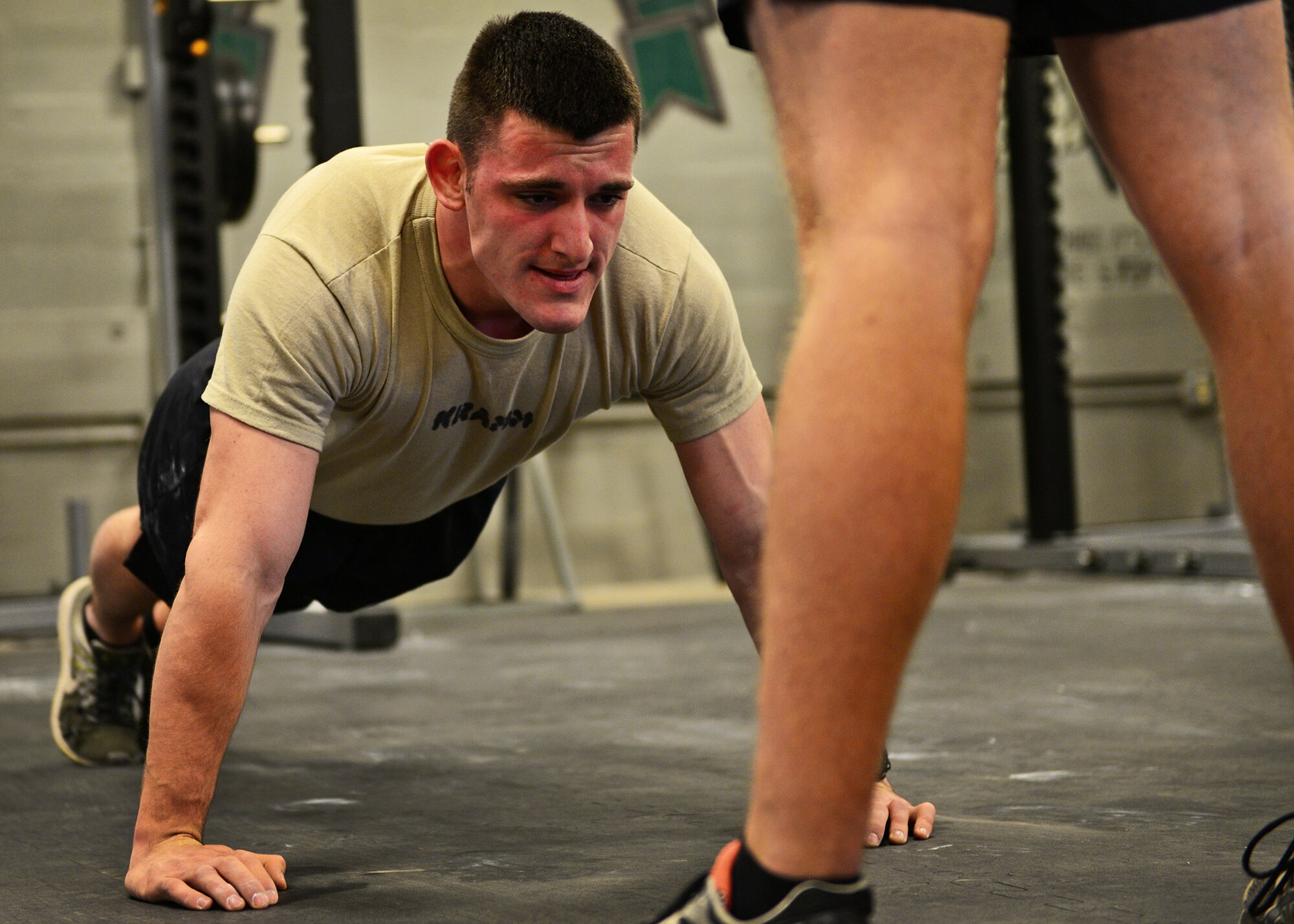 U.S. Air Force Airman Basic Cole Kramn, a Survival, Evasion, Resistance and Escape Specialist Training Orientation Course candidate, completes a push-up during a mock physical fitness assessment at the SERE specialist schoolhouse at Joint Base San Antonio-Lackland, Texas, March 22, 2018. About 60 percent of the SERE specialist candidates do not successfully complete the course, with the majority of candidates self-eliminating from the program.  (U.S. Air Force photo by Staff Sgt. Chip Pons)