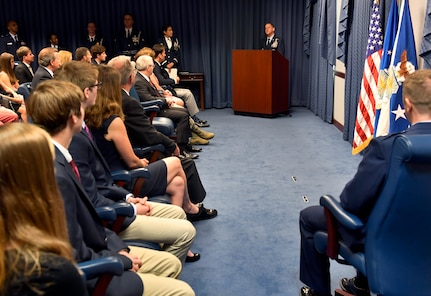 Air Force Chief of Staff Gen. David L. Goldfein talks about the actions taken by Lt. Col Daniel Finnegan during the Kolligian Trophy presentation in the Pentagon, Arlington, Va., June 25, 2018. (U.S. Air Force photo by Wayne A. Clark)