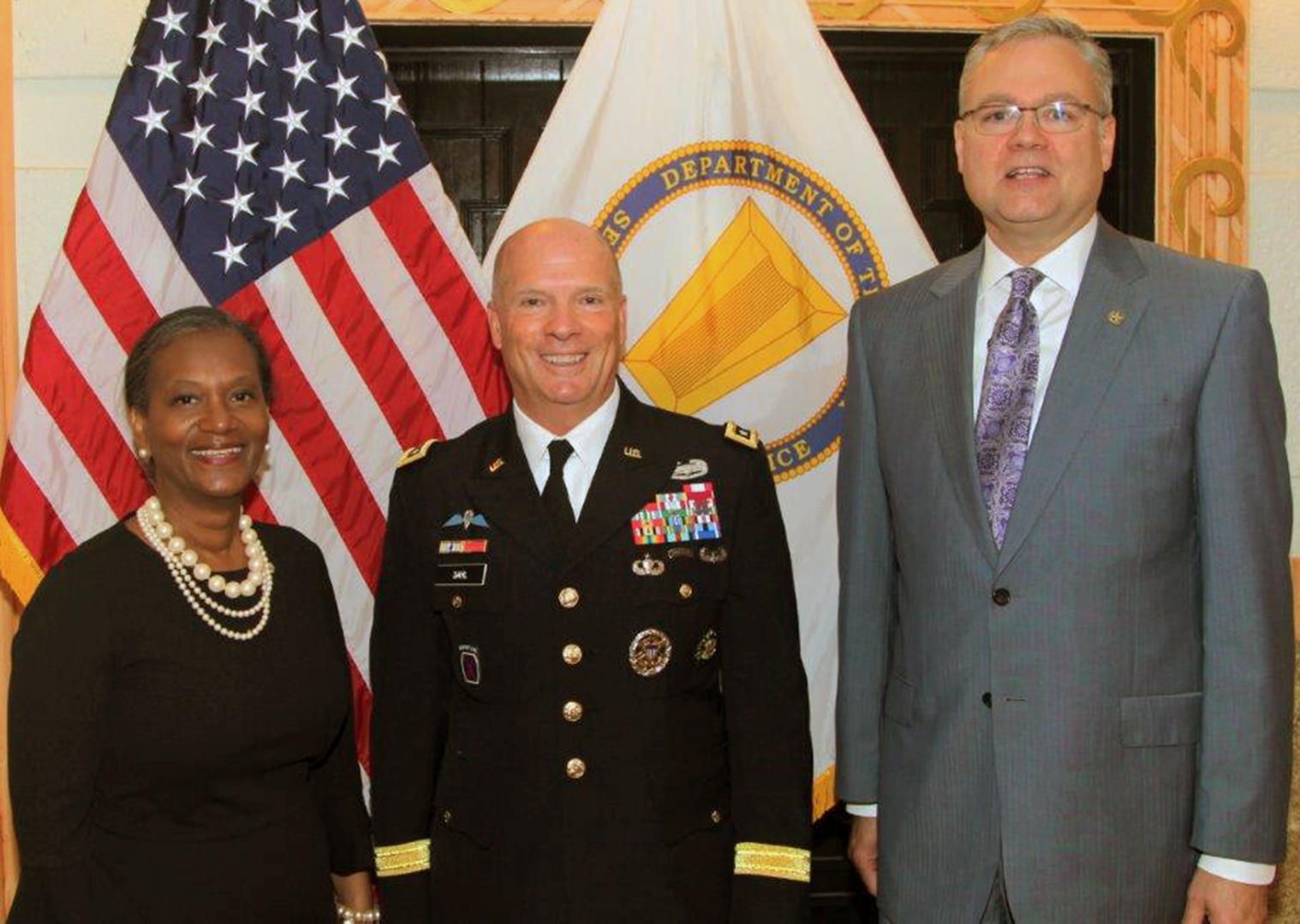 Lt. Gen. Kenneth Dahl (center), commanding general, U.S. Army Installation Management Command, welcomes IMCOM's two new Senior Executive Service leaders within its headquarters staff at Joint Base San Antonio-Fort Sam Houston. At left is Delia Adams, who, as IMCOM’s senior contracting executive, is responsible for an annual $4.5 billion portfolio of appropriated and non-appropriated contracts and procurements. At right is J. Randall Robinson, who will serve as the executive deputy to the commanding general.