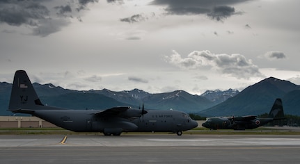 U.S. Air Force C-130J Super Hercules aircraft from Yokota Air Base, Japan, and Japan Air Self-Defense Force C-130H Hercules aircraft from Hamamatsu Air Base, Japan, prepare for takeoff during Red Flag-Alaska 18-2 operations at Joint Base Elmendorf-Richardson, Alaska, June 21, 2018. RF-A is Pacific Air Forces’ premier air combat exercise that provides joint offensive counter-air, interdiction, close air support and large force employment training in a simulated combat environment.