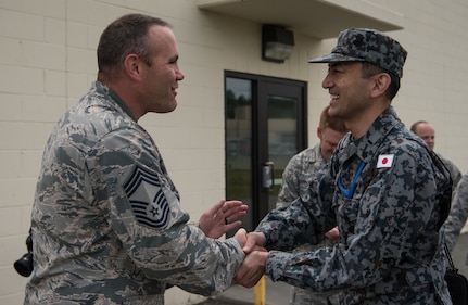 U.S. Air Force Chief Master Sgt. Mike Day, 962nd Airborne Air Control Squadron superintendent, says goodbye to Japan Air Self-Defense Force senior enlisted advisor Warrant Officer Masahiro Yokota at the end of a visit to Joint Base Elmendorf-Richardson, Alaska, June 19, 2018. During his visit, Yokota toured the installation and oversaw JASDF Airmen working alongside American forces during Pacific Air Forces’ premier air combat exercise, Red Flag-Alaska, iteration 18-2.