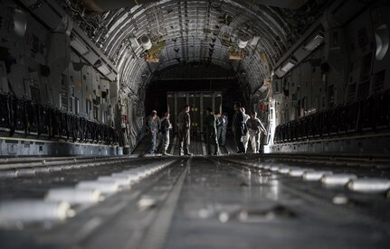 U.S. Air Force Master Sgt. Spencer Stacey, 517th Airlift Squadron operations superintendent, gives a tour of a C-17 Globemaster III to Japan Air Self-Defense Force senior enlisted advisor Warrant Officer Masahiro Yokota at Joint Base Elmendorf-Richardson, Alaska, June 19, 2018. During his visit, Yokota toured the installation and oversaw JASDF Airmen working alongside American forces during Pacific Air Forces’ premier air combat exercise, Red Flag-Alaska, iteration 18-2.