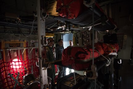 Japan Air Self-Defense Force senior enlisted advisor Warrant Officer Masahiro Yokota (middle) participates in a tour of a C-130 Hercules at Joint Base Elmendorf-Richardson, Alaska, June 19, 2018. During his visit, Yokota toured the installation and oversaw JASDF Airmen working alongside American forces during Pacific Air Forces’ premier air combat exercise, Red Flag-Alaska, iteration 18-2.