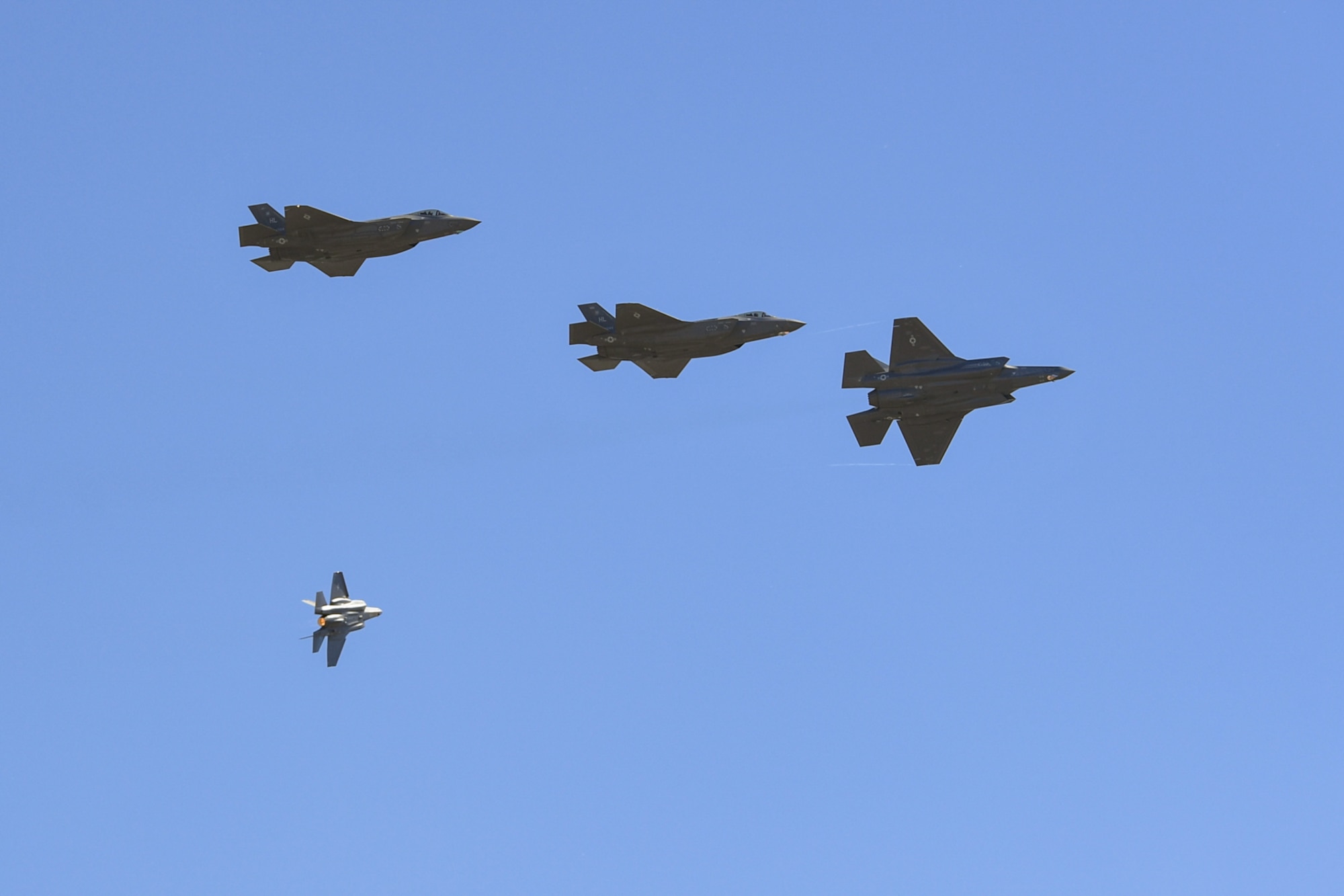 A four-ship of F-35A Lightning IIs from the 388th Fighter Wing fly above the Warriors Over the Wasatch Air and Space Show June 23, 2018, at Hill Air Force Base, Utah. The jets were part of an F-35 attack demonstration June 23-24. (U.S. Air Force photo by Cynthia Griggs)