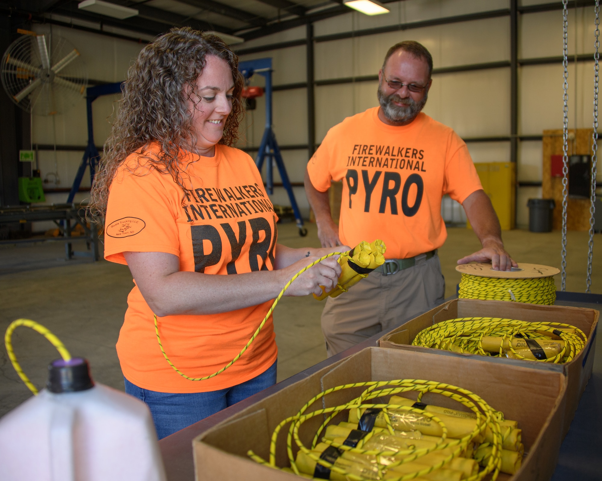 Stacey Matthews and Joey Elliot, Firewalkers International Pyro, work with explosives on June 20, 2018, at Hill Air Force Base, Utah. The Firewalkers team provide the explosions that accompanied some of the aircraft demonstrations during the Warriors Over the Wasatch Air Show on June 23-24. (U.S. Air Force photo by R. Nial Bradshaw)
