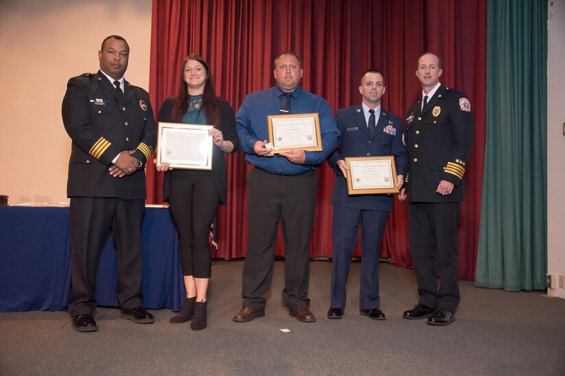 U.S. Air Force Tech Sgt. Richard Penny, 633rd Air Base Wing Inspector General management internal control toolset administrator and special access program manager, Adam Bradshaw and Ashley Staley receive Citizen Lifesaving certificates at Fort Monroe, Virginia, June 7, 2018.