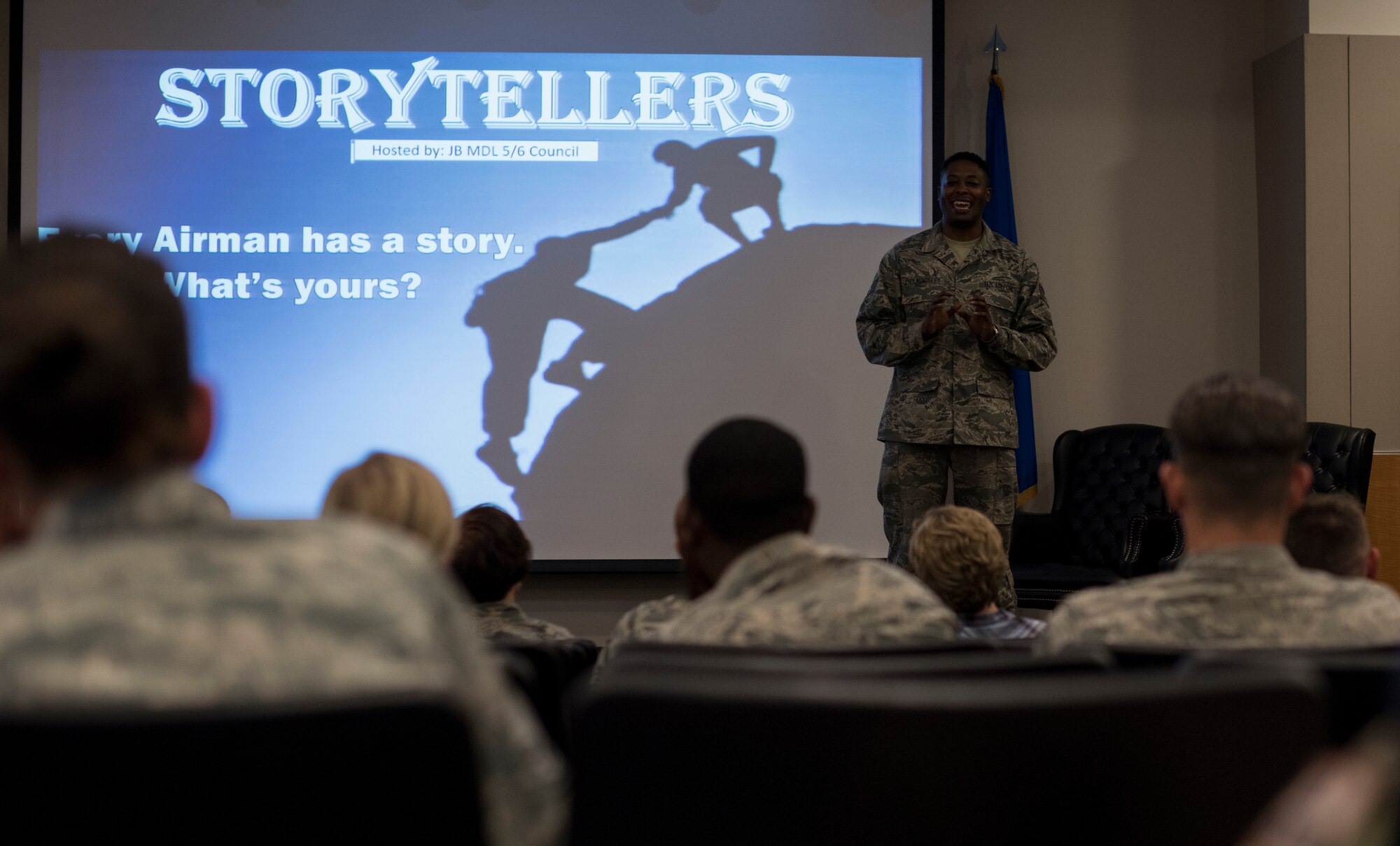 U.S. Air Force Staff Sgt. Guy Cholmondeley, 87th Contracting Squadron administrator, speaks at the Storytellers event on Joint Base McGuire-Dix-Lakehurst, N.J., June 20, 2018. Cholmondeley talked about his emotional journey while taking care of his father who passed away from Alzheimer’s. (U.S. Air Force photo by Airman Ariel Owings)