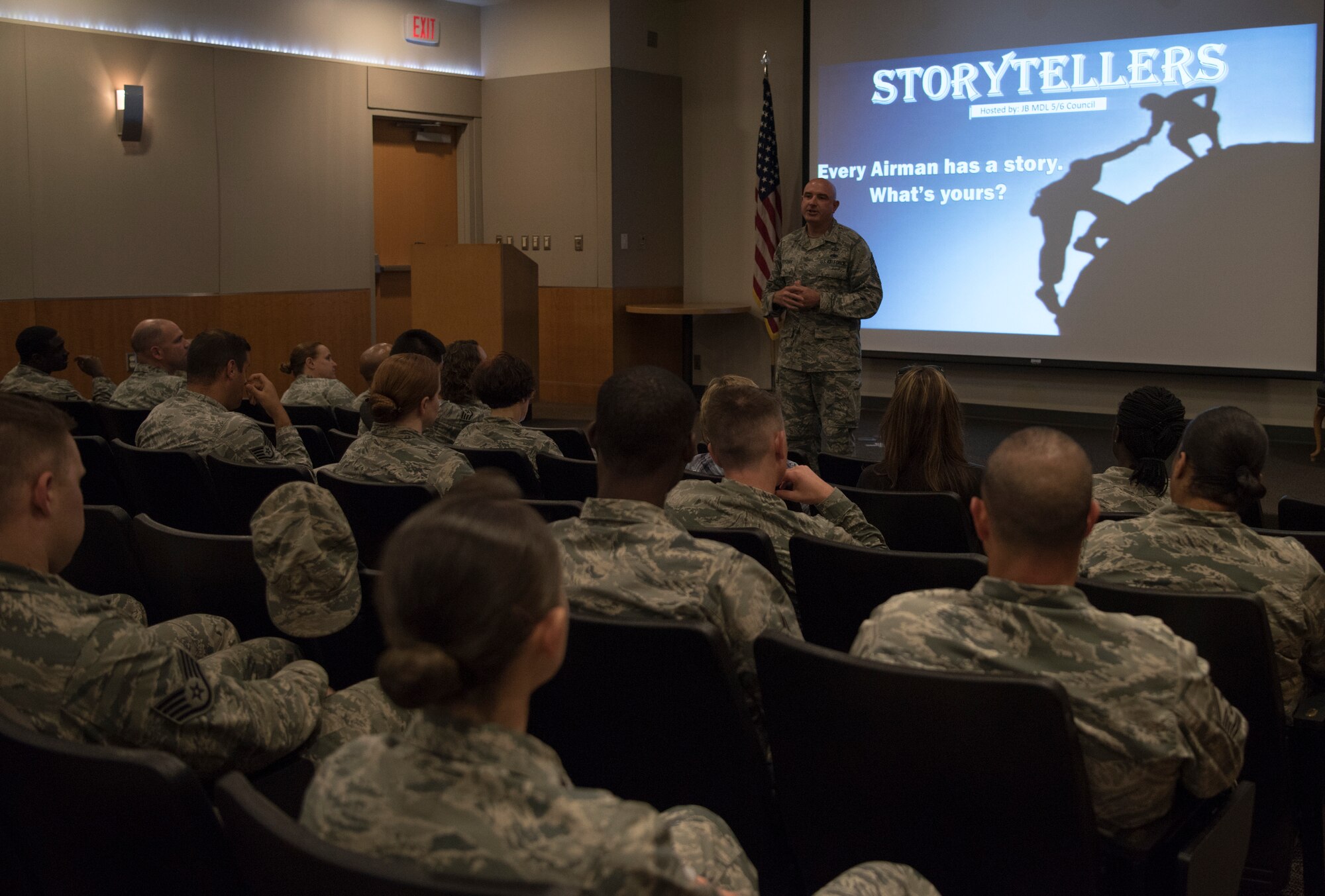 U.S. Air Force Chief Master Sgt. Christopher Yevchak, 87th Air Base Wing command chief, gives an invocation during the Storytellers event on Joint Base McGuire-Dix-Lakehurst, N.J., June 20, 2018. Yevchak spoke of the importance on the open-forum convention to help community members learn resiliency by hearing others’ experiences and outcomes. (U.S. Air Force photo by Airman Ariel Owings)