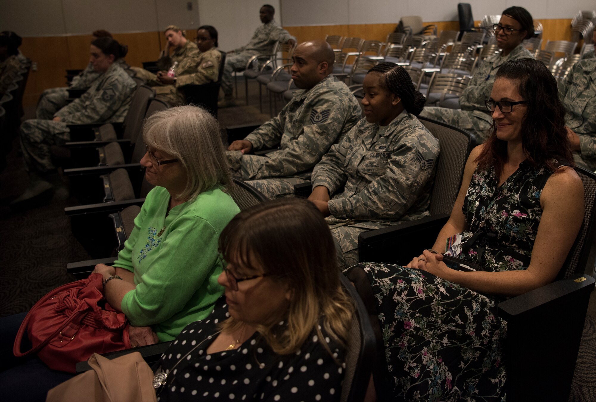 Audience members laugh at joke during the Storytellers convention on Joint Base McGuire-Dix-Lakehurst, N.J., June 20, 2018. Air Force Master Sgt. Michelle Humphrey, 87th ABW first sergeant, said Storytellers gives people the opportunity to share their experiences of unique situations with others and people should know they are not alone. (U.S. Air Force photo by Airman Ariel Owings)