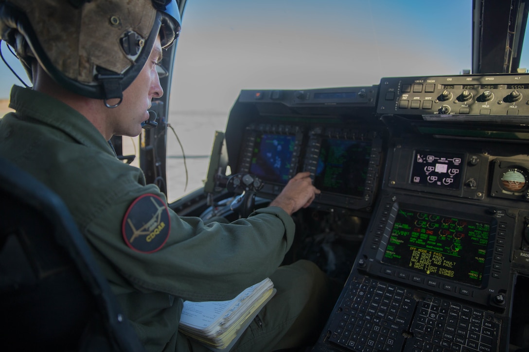 Sgt. Curtis Anglin, a tiltrotor crew chief with Marine Medium Tiltrotor Squadron 764, Marine Aircraft Group 41, 4th Marine Aircraft Wing, conducts preflight inspections and engine run-ups before an aerial assault, during Integrated Training Exercise 4-18 at Marine Corps Air Ground Combat Center Twentynine Palms, Calif., June 23, 2018. VMM-764, known as “moonlight,” is based out of Marine Corps Air Station Miramar and provided air combat element support to Marine Air Ground Task Force 23 during ITX 4-18. (U.S. Marine Corps photo by Lance Cpl. Samantha Schwoch/released)