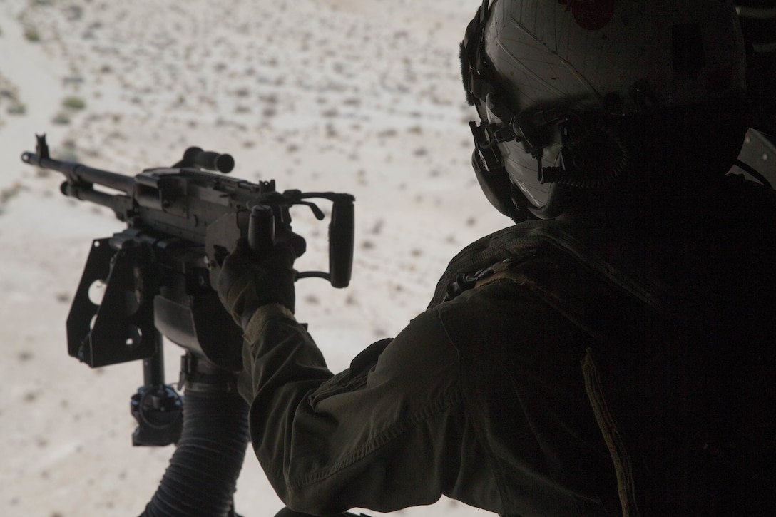 Cpl. Chase Clark, a tiltrotor crew chief with Marine Medium Tiltrotor Squadron 764, Marine Aircraft Group 41, 4th Marine Aircraft Wing, ensures a landing zone is secure before an air assault during Integrated Training Exercise 4-18, at Marine Corps Air Ground Combat Center Twentynine Palms, Calif., June 23, 2018. VMM-764, known as “moonlight,” is based out of Marine Corps Air Station Miramar and provided air combat element support to Marine Air Ground Task Force 23 during ITX 4-18. (U.S. Marine Corps photo by Lance Cpl. Samantha Schwoch/released)