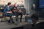 Journalist interviews Army general at technology summit.
