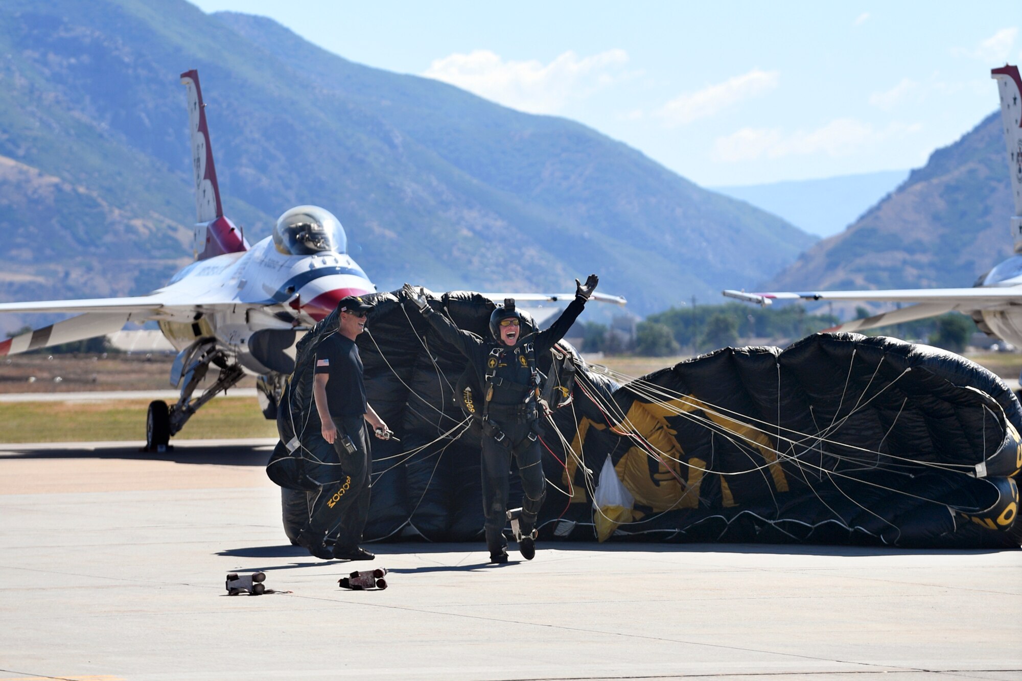 The U.S. Special Operations Command The Para-Commandos parachute demonstration team member lands on the ramp during the Warriors Over the Wasatch Air and Space Show June 24, 2018, at Hill Air Force Base, Utah. The Para-Commandos are comprised of active duty special operators, such as Army Special Forces, Army Rangers, Navy SEALs, Air Force Combat Controllers and Marine Raiders. (U.S. Air Force photo by Todd Cromar)
