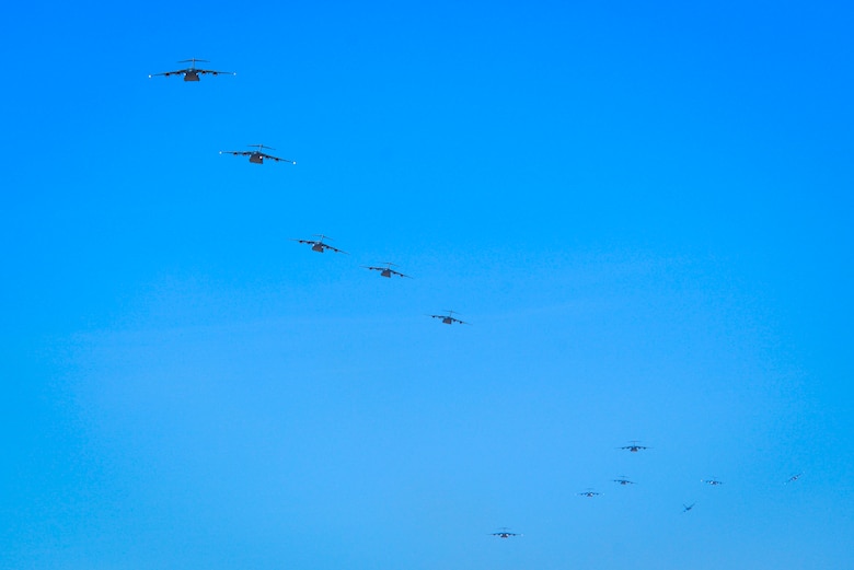 Twelve C-17 Globemaster III assigned to various Air Mobility Command bases in the United States prepare to land at Nellis Air Force Base, Nevada, June 9, 2018. The C-17s participated in Operation Coyote Freedom during the U.S. Air Force Weapons School Integration. (U.S. Air Force photo by Airman Bailee A. Darbasie)