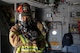 Junichiro Sugita, 374th Civil Engineer Squadron firefighter, communicates with his team during an Emergency Response Exercise