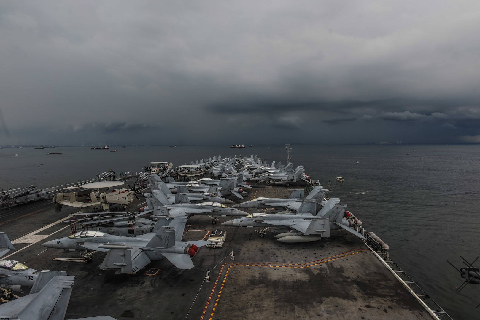 PHILIPPINE SEA (June 26, 2018) The Navy's forward-deployed aircraft carrier, USS Ronald Reagan (CVN 76), steams along the coast of the Republic of the Philippines before a scheduled port visit in Manila. Ronald Reagan, the flagship of Carrier Strike Group 5, provides a combat-ready force that protects and defends the collective maritime interests of its allies and partners in the Indo-Pacific region.