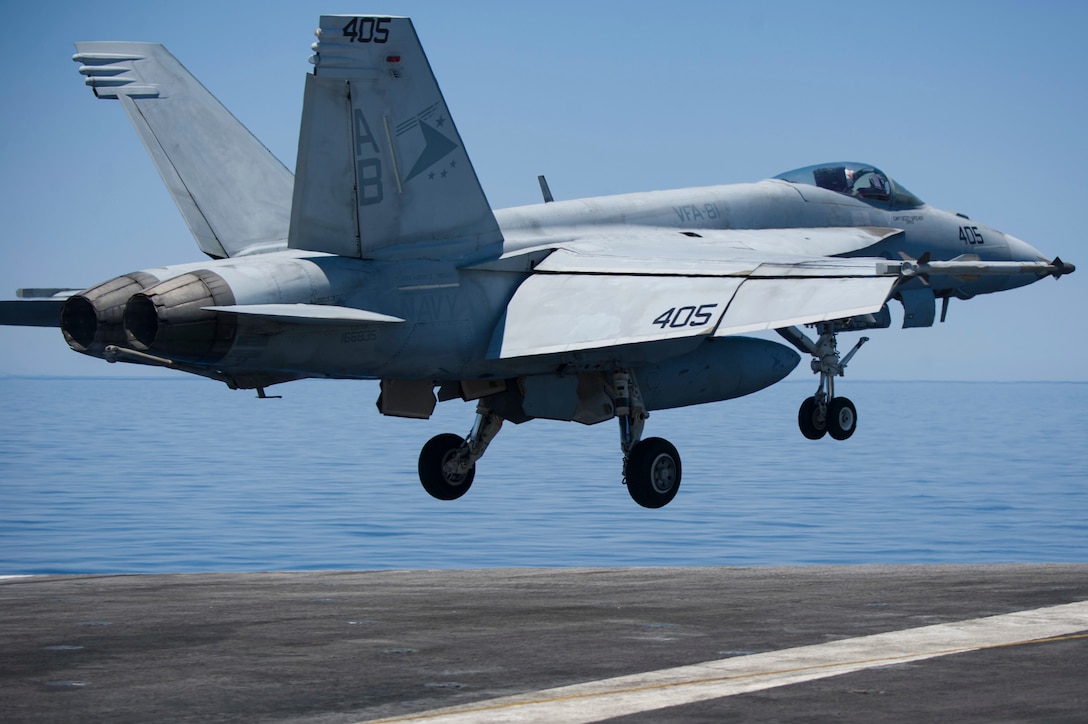 A pilot launches his An F/A-18F Super Hornet aircraft from the flight deck.