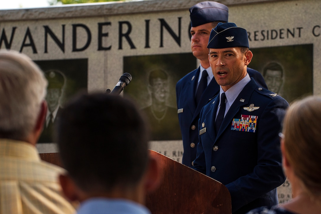Commander gives speech at memorial ceremony.
