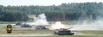 Tanks from Austria, France, Germany, Poland, Sweden, Ukraine, the United Kingdom and the United States fire side-by-side during the Friendship Shoot of the 2018 Strong Europe Tank Challenge, June 8, on the Grafenwoehr Training Area, Germany.