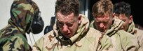 U.S. Soldiers assigned to 7th Army Training Command (7ATC) exit the gas chamber during the chemical, biological, radiological and nuclear lane as part of the 7ATC Best Warrior Competition June 20, 2018 at Grafenwoehr Training Area, Germany.