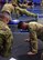 U.S. Army Soldiers assigned to the 5-52 Air Defense Artillery perform the push up portion of an Army physical fitness test (APFT), June 18, 2018, at Al Udeid Air Base, Qatar. The APFT was the first of three physical challenges Soldiers performed during a quarterly Best Warrior Competition. (U.S. Air Force photo by Staff Sgt. Caitlin Conner)