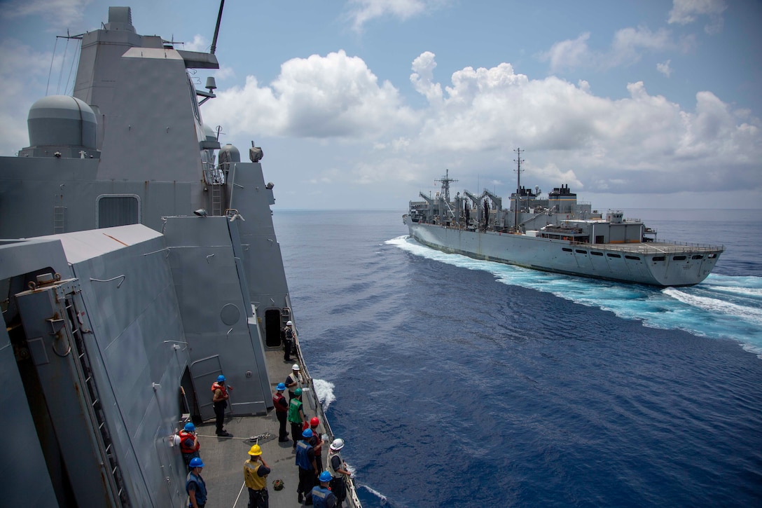 U.S. Sailors with the USS Arlington prepare to conduct a replenishment at sea from the USNS Supply during Amphibious Squadron MEU Integration training in the Atlantic Ocean, June 15, 2018. PHIBRON-MEU Integration is a two-week training evolution that allows Sailors and U.S. Marines to train as a cohesive unit in preparation for their upcoming deployment.
