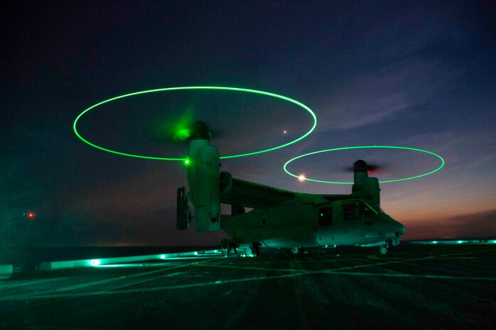 A U.S. Marine MV-22 Osprey with the 22nd Marine Expeditionary Unit lands on the deck of the USS Arlington during Amphibious Squadron MEU Integration training in the Atlantic Ocean, June 15, 2018. PHIBRON-MEU Integration is a two-week training evolution that allows Sailors and U.S. Marines to train as a cohesive unit in preparation for their upcoming deployment.