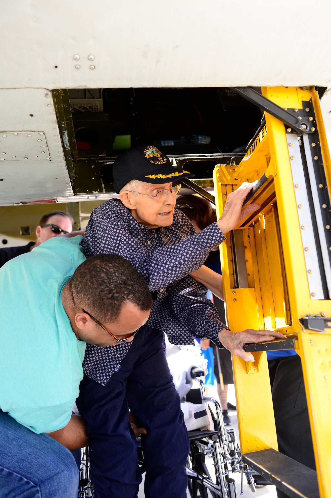 Donald Nesbit, a World War II veteran, is assisted into a B-25 bomber June 22, 2018, at Hill Air Force Base, Utah. The bomber was on display for the Warriors Over the Wasatch Air and Space Show. (U.S. Air Force photo by David Perry)