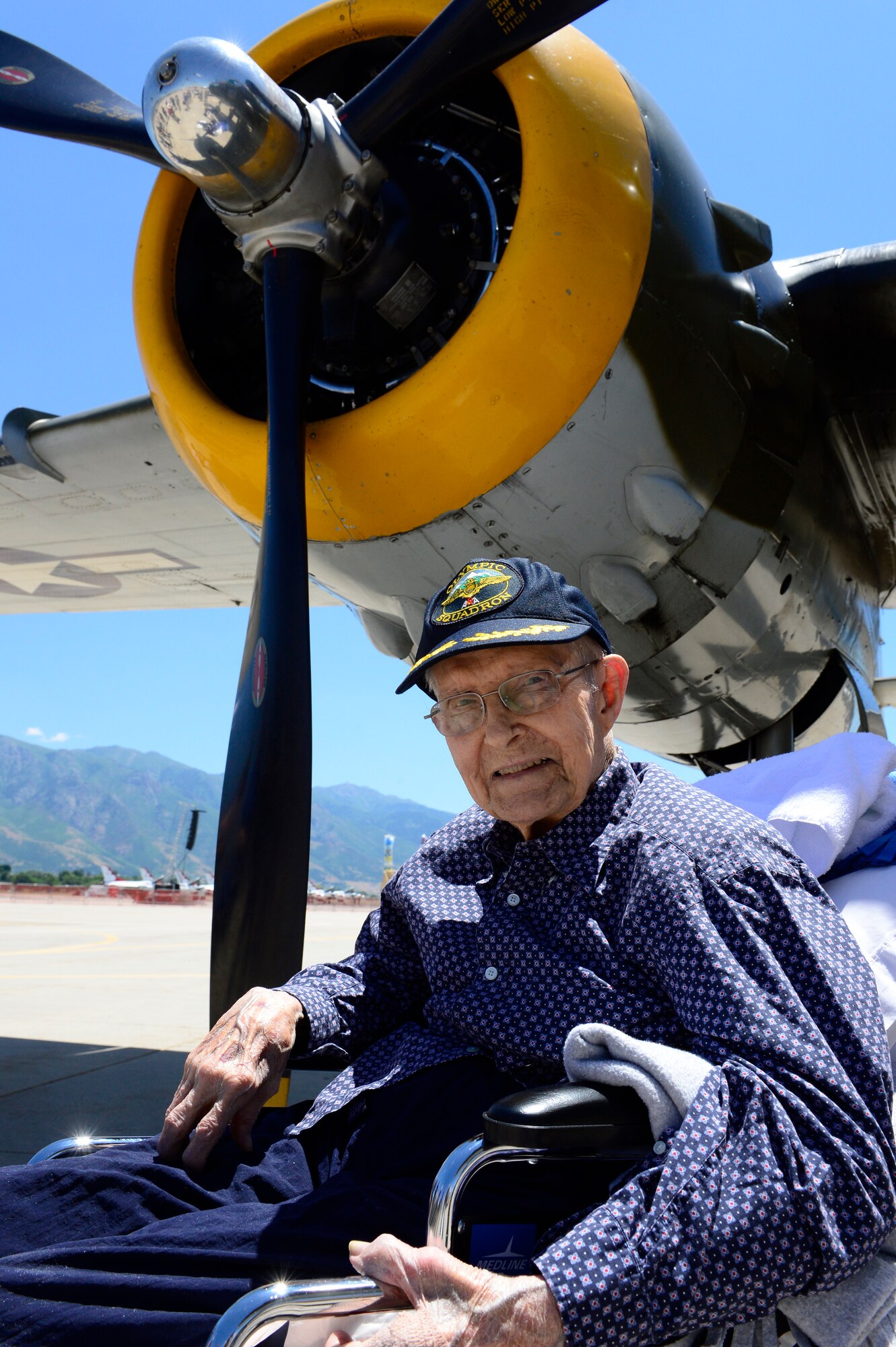 Donald Nesbit, a World War II veteran, poses in front of the engine of a B-25 bomber June 22, 2018, at Hill Air Force Base, Utah. The bomber was on display for the Warriors Over the Wasatch Air and Space Show. (U.S. Air Force photo by David Perry)