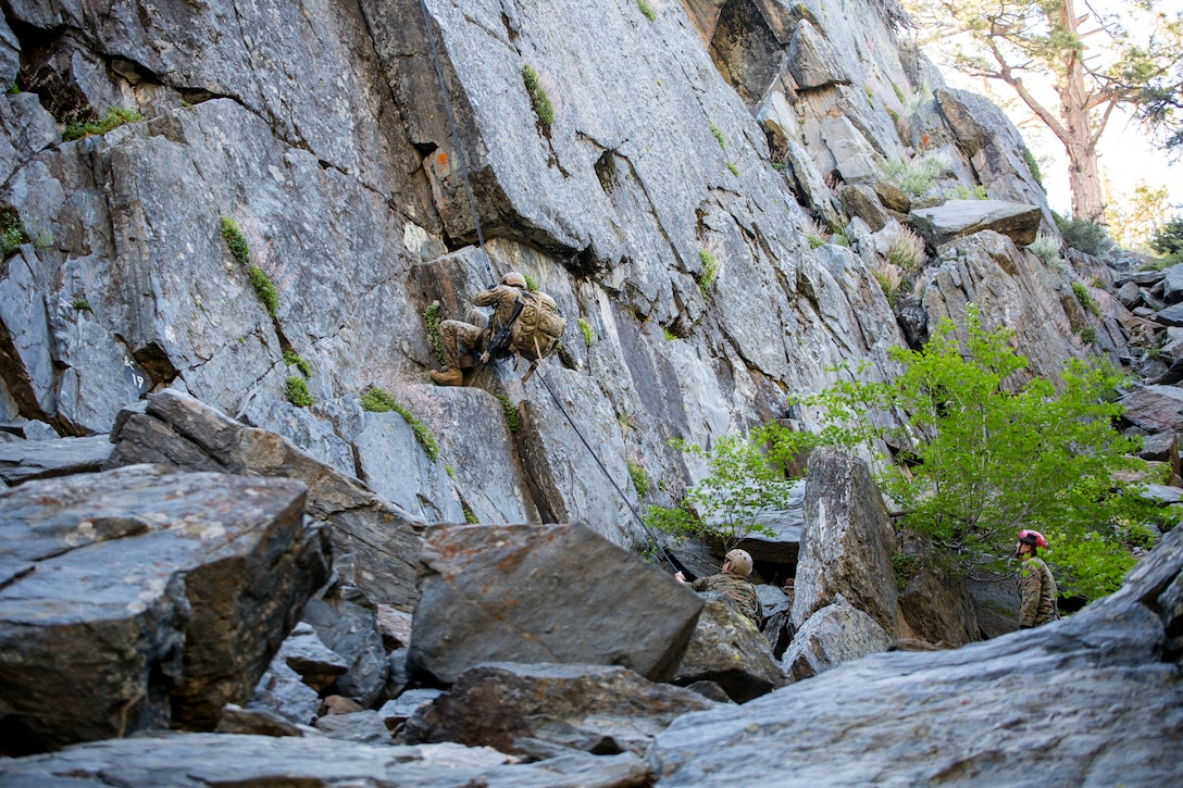 Marines with 4th Reconnaissance Battalion, 4th Marine Division, rappel down a cliffside during Mountain Exercise 3-18 at Mountain Warfare Training Center, Bridgeport, Calif., June 20, 2018.
