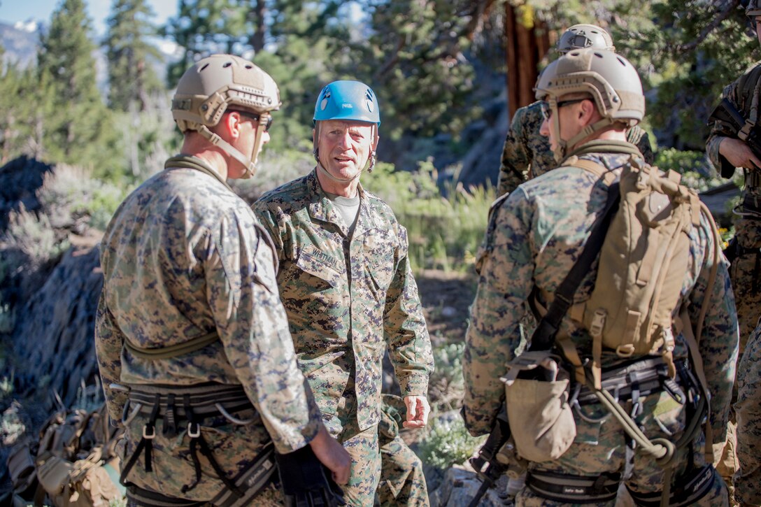 Maj. Gen. Burke W. Whitman, commanding general of 4th Marine Division, talks with reconnaissance Marines with 4th Reconnaissance Battalion, 4th MARDIV, during a rappel training exercise, at Mountain Exercise 3-18, Mountain Warfare Training Center, Bridgeport, Calif., June 20, 2018.