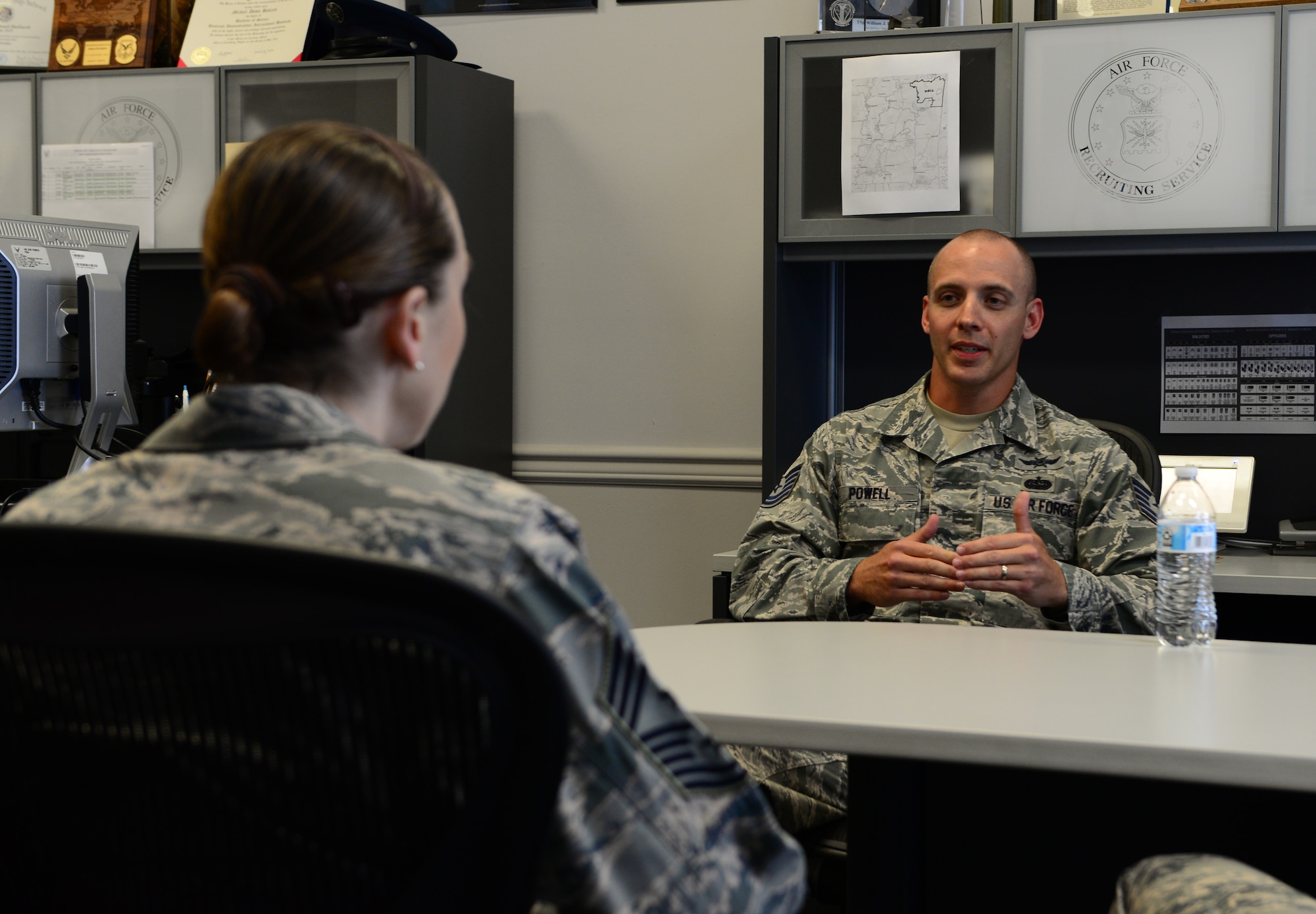U.S. Air Force Chief Master Sgt. Juliet Gudgel, command chief of Air Education and Training Command, speaks with Tech. Sgt. William Powell, 331st Recruiting Squadron enlisted recruiter, at the local recruiting office in Columbus, Mississippi, June 21, 2018. Gudgel asked Powell about what she and her team could do to make people more interested in joining the Air Force. (U.S. Air Force photo by Airman 1st Class Beaux Hebert)