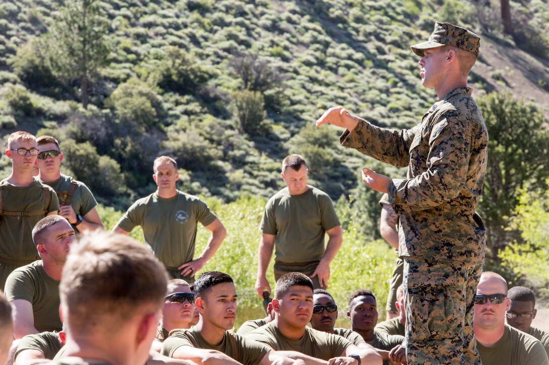Staff Sgt. James Fowler, an instructor with Mountain Warfare Training Center, gives a lesson to Marines with 2nd Battalion, 24th Marine Regiment, 23rd Marines, 4th Marine Division, on how to safely traverse a stream, during Mountain Exercise 3-18, at MCMWTC, Bridgeport, Calif., June 21, 2018.