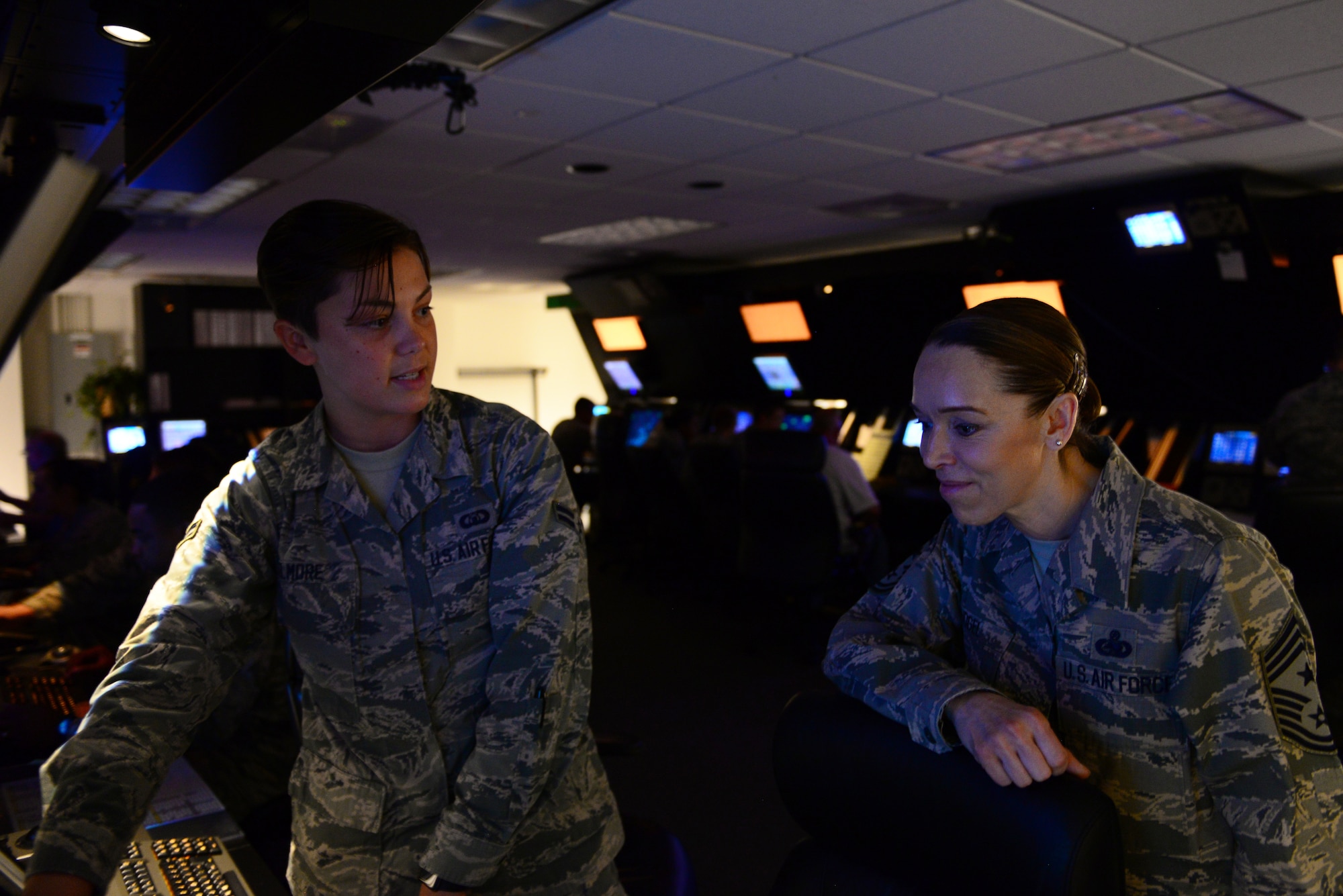 U.S. Air Force Airman 1st Class Jaiden Elmore, 14th Operations Support Squadron air traffic controller, shows Chief Master Sgt. Juliet Gudgel, command chief of Air Education and Training Command, what Airmen in the Radar Approach Control do on a daily basis at Columbus Air Force Base, Mississippi, June 21, 2018. Columbus AFB has the busiest airspace in AETC, flying over 300 sorties per day. (U.S. Air Force photo by Airman 1st Class Beaux Hebert)